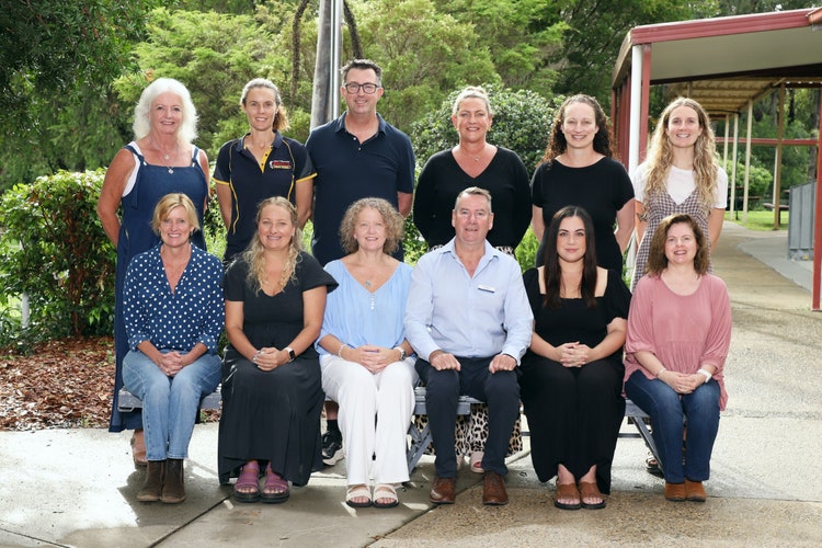 A group photo taken on school photo day showing twelve staff of Bonville Public School